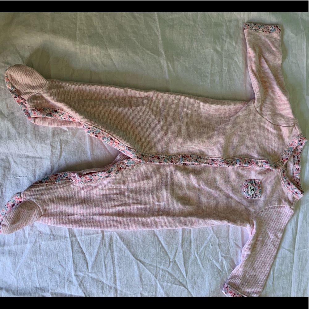 Pink floral rim one piece with a small pocket.